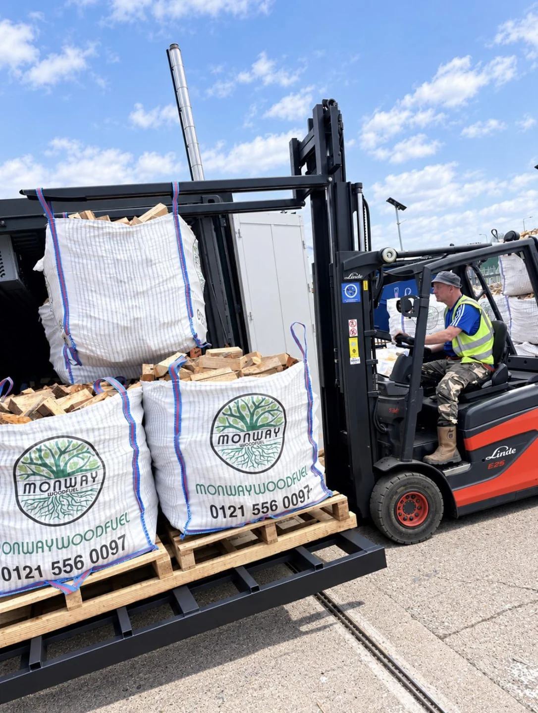 Forklift loading branded Monway Woodfuel bulk bags