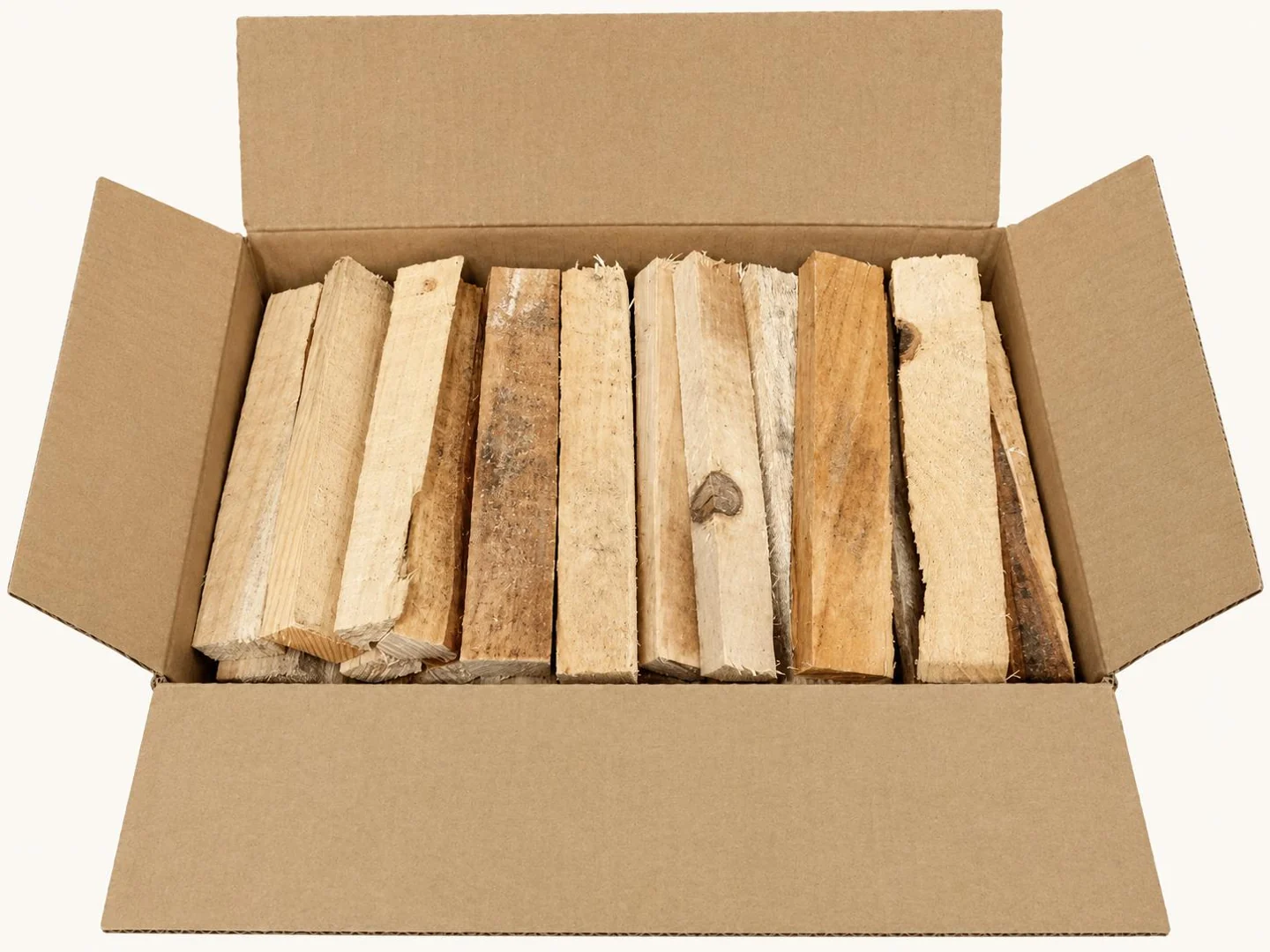 Wood pieces arranged inside an open cardboard box