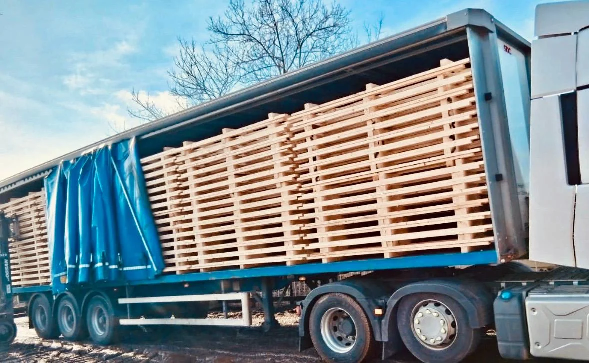 Bespoke wooden pallets stacked on a delivery lorry