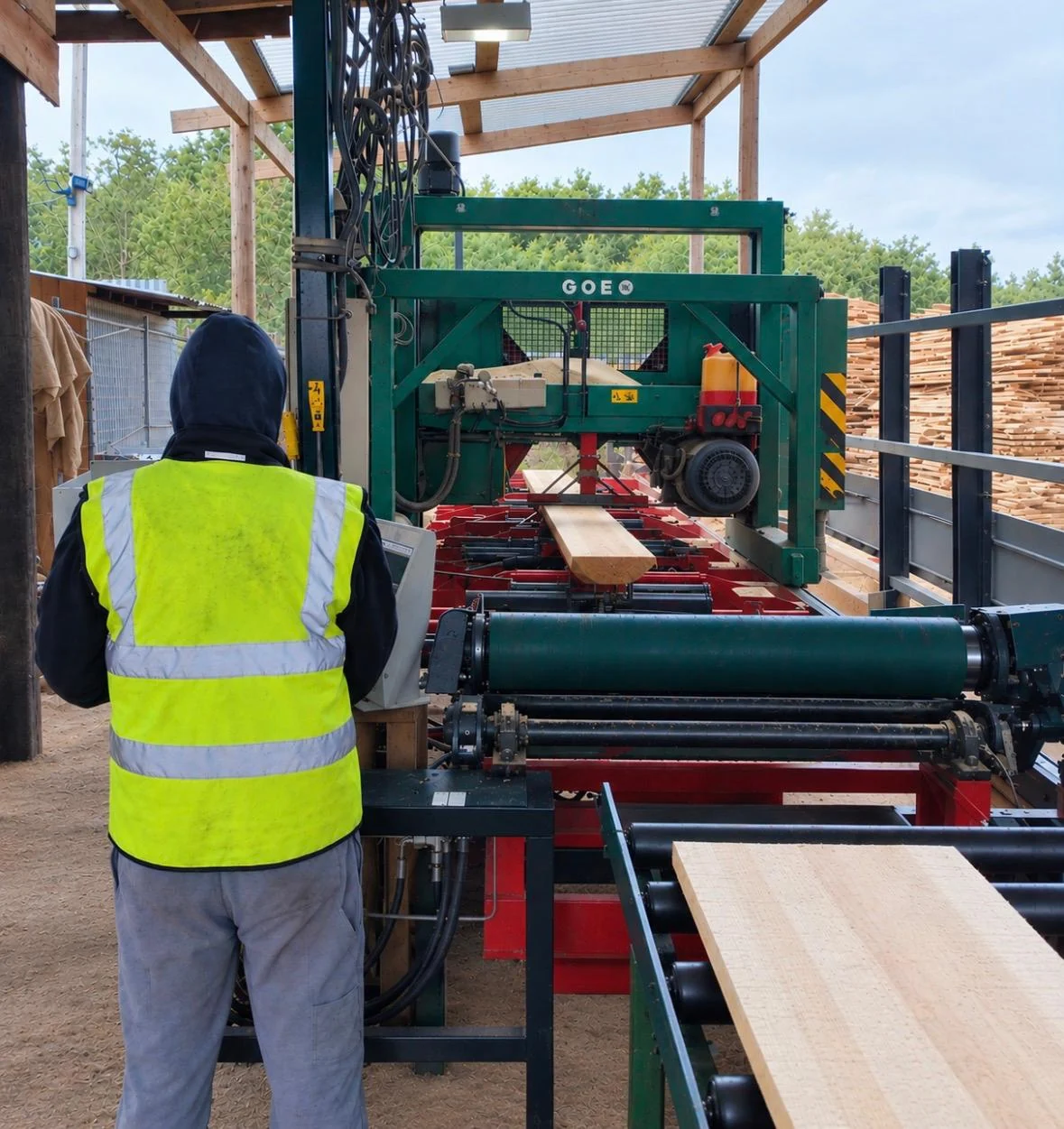 Timber passing through machinery at the Monway sawmill